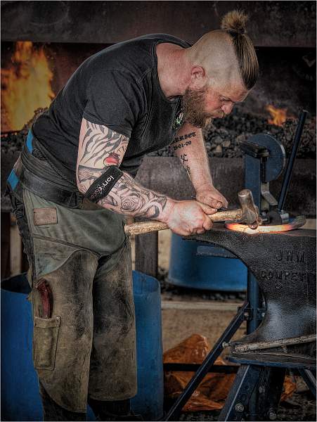 i0602.jpg - Blacksmith at Work